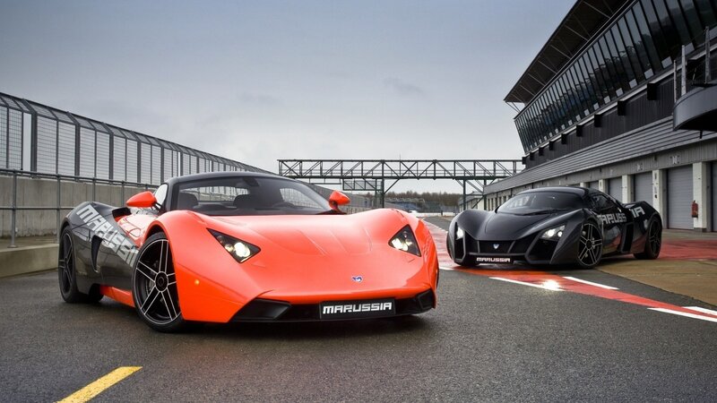 Two Marussia sports cars on a racetrack