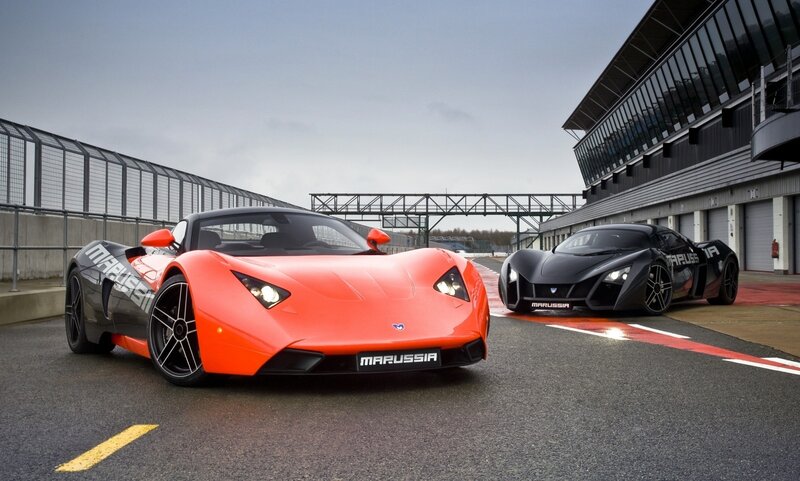 Two Marussia sports cars on a racetrack