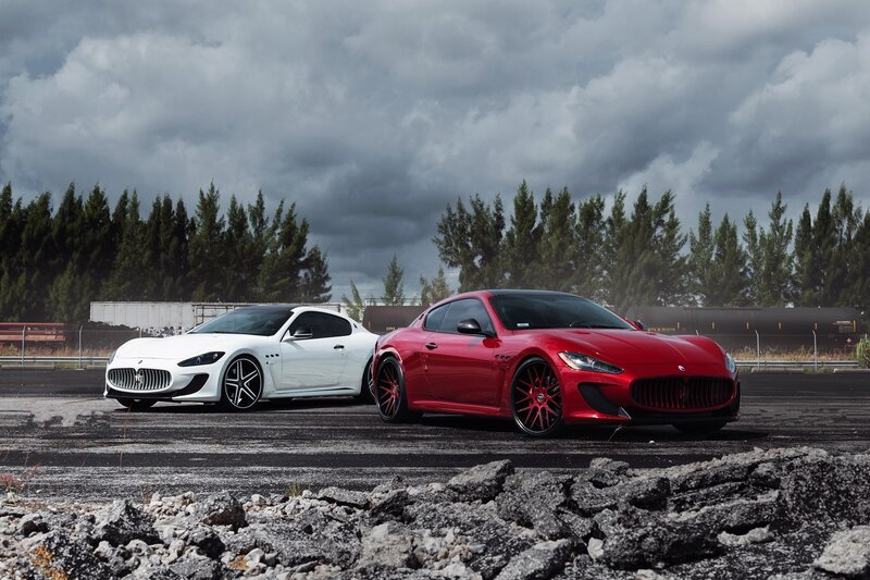 Two Maserati cars on a tarmac