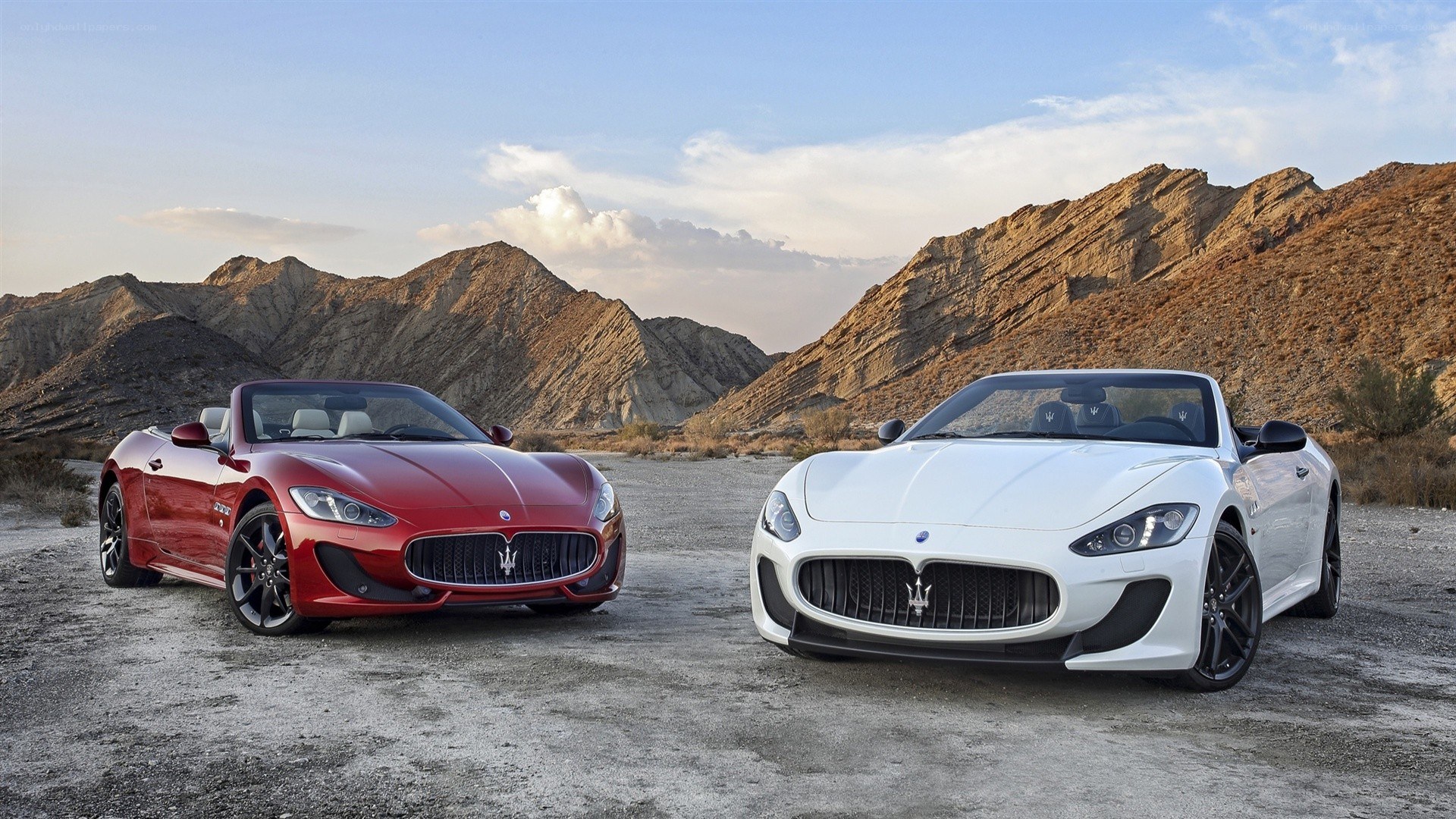 Two Maserati convertibles in desert