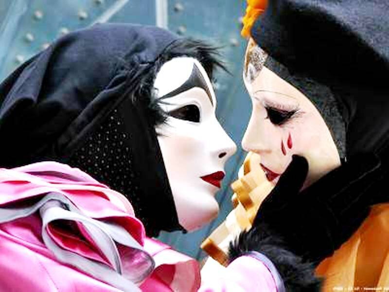 Two Masked Figures — Black, Dramatic