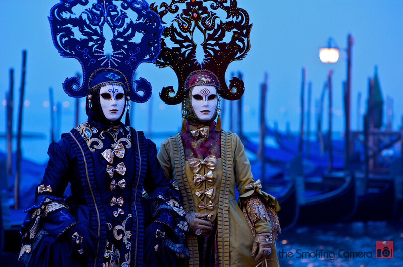 Two Masked Figures — Blue, Dramatic
