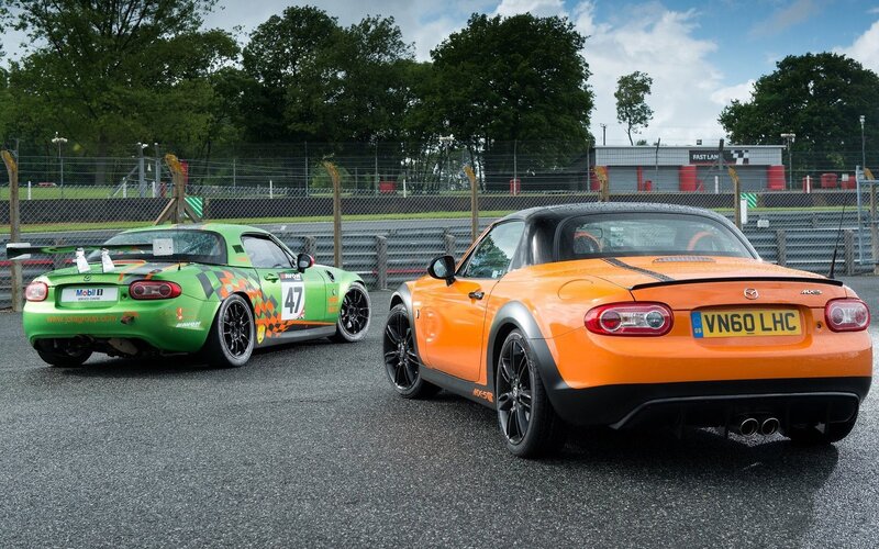Two Mazda MX-5 cars on a racetrack