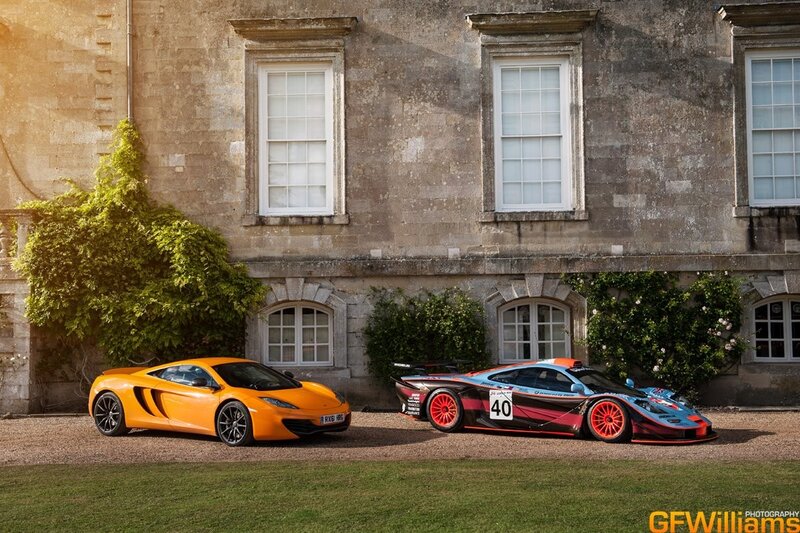 Two McLaren cars at a stately home