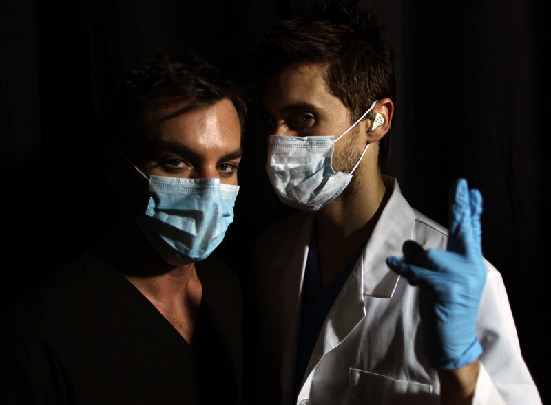 Two medical professionals in masks