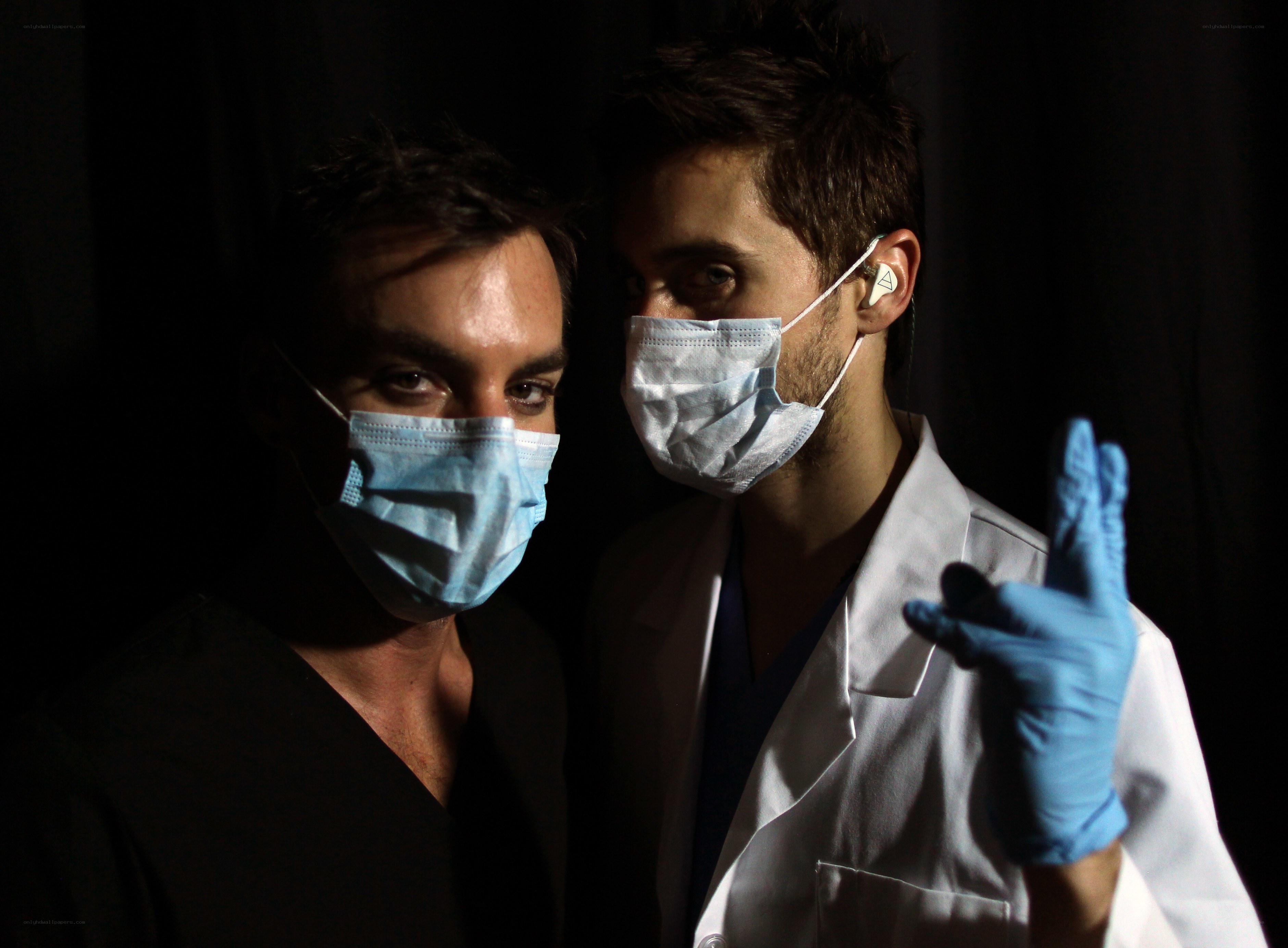 Two medical professionals in masks