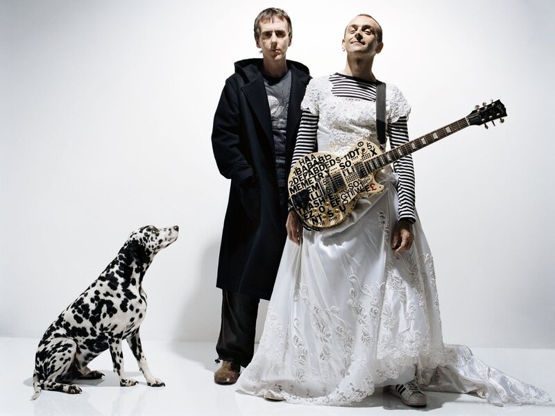 Two men and a dalmatian dog