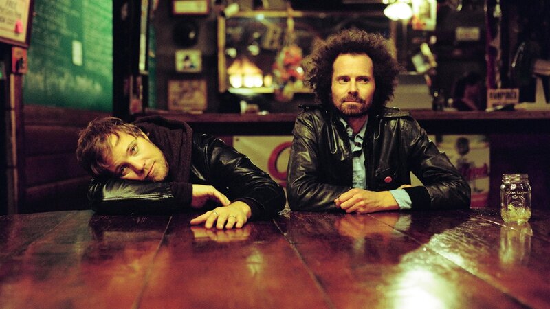 two men at a bar table