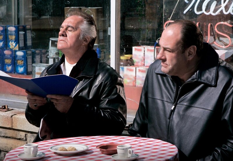 Two men at a cafe table