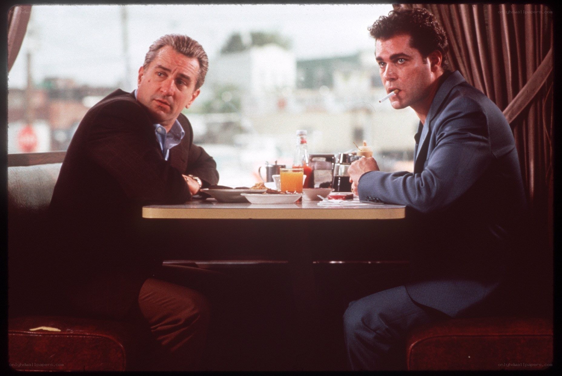Two men at a diner table