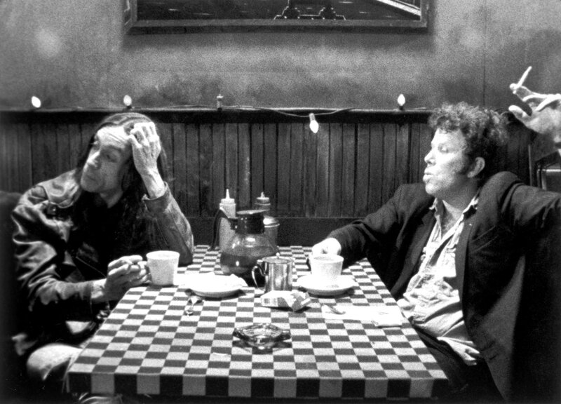 Two men at a diner table