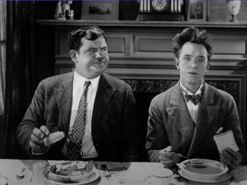 Two men at a dinner table