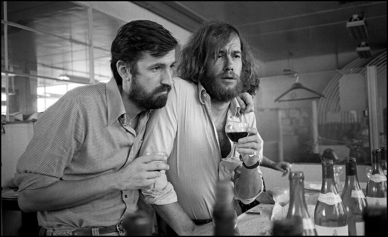Two Men at a Table — Black, Serious