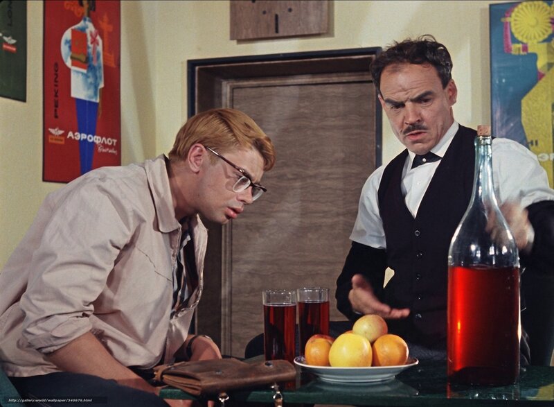 Two men at a table with drinks