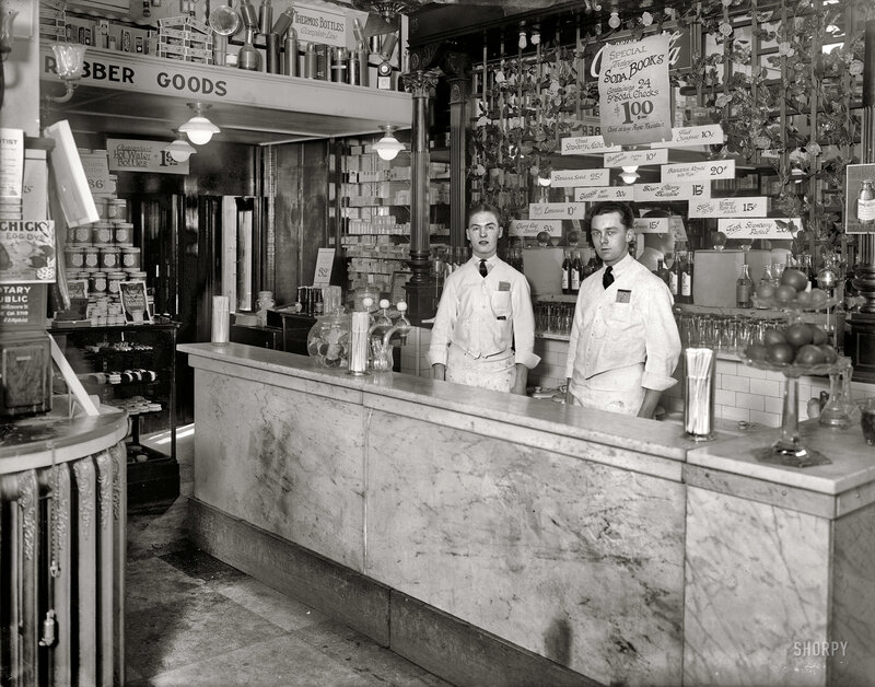 Two Men Behind Counter