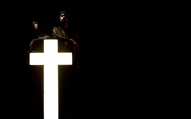 Two Men Behind Cross