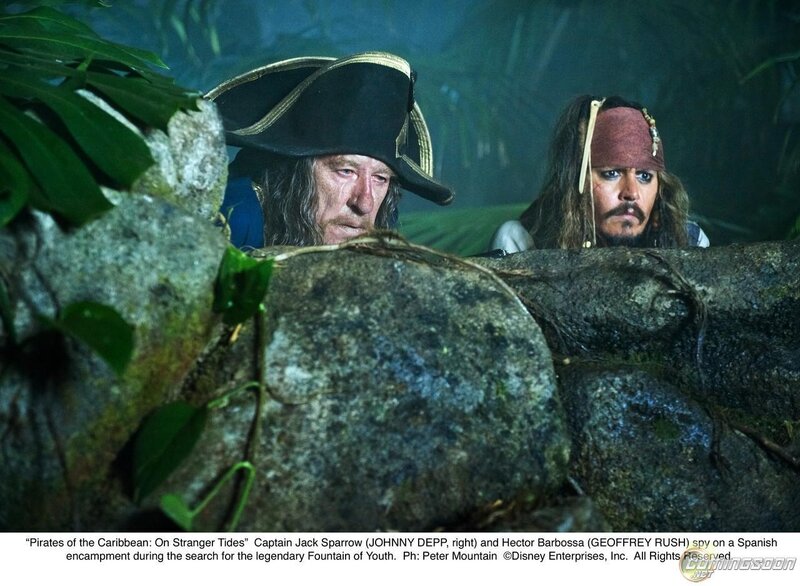 Two Men Behind Rocks