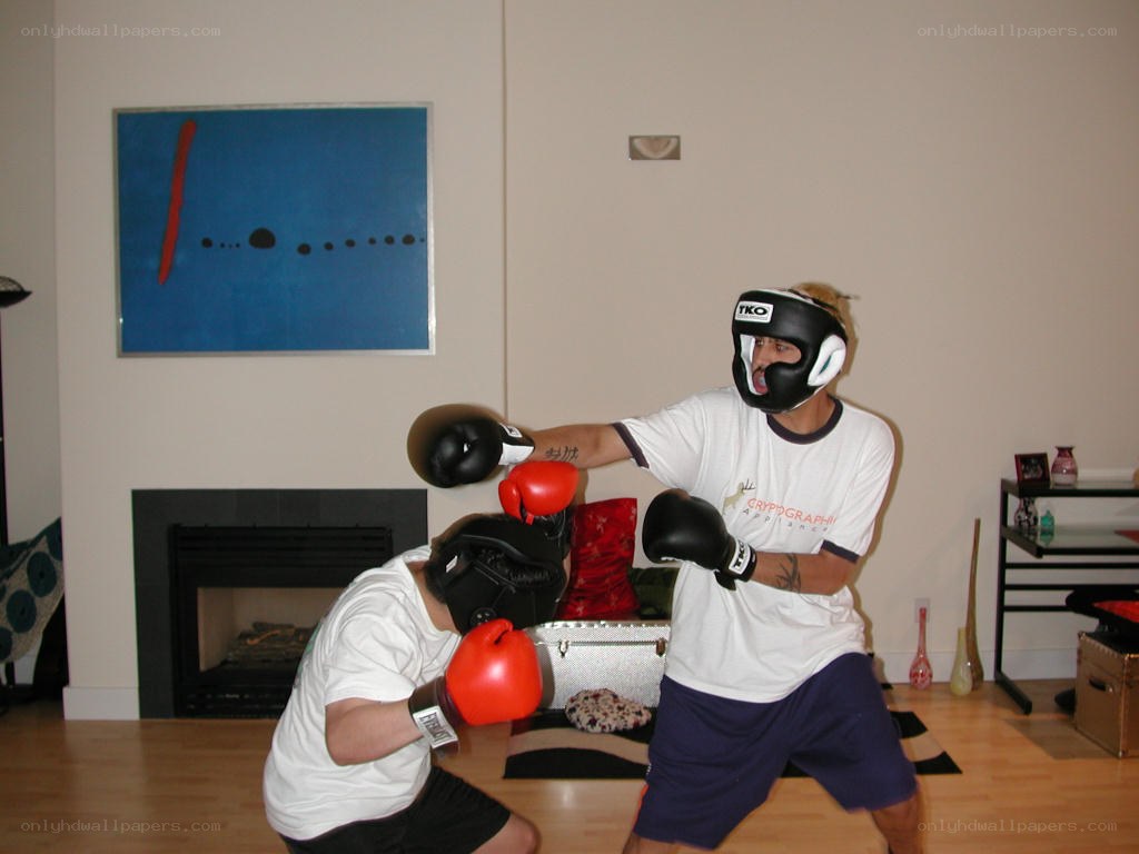 Two men boxing indoors