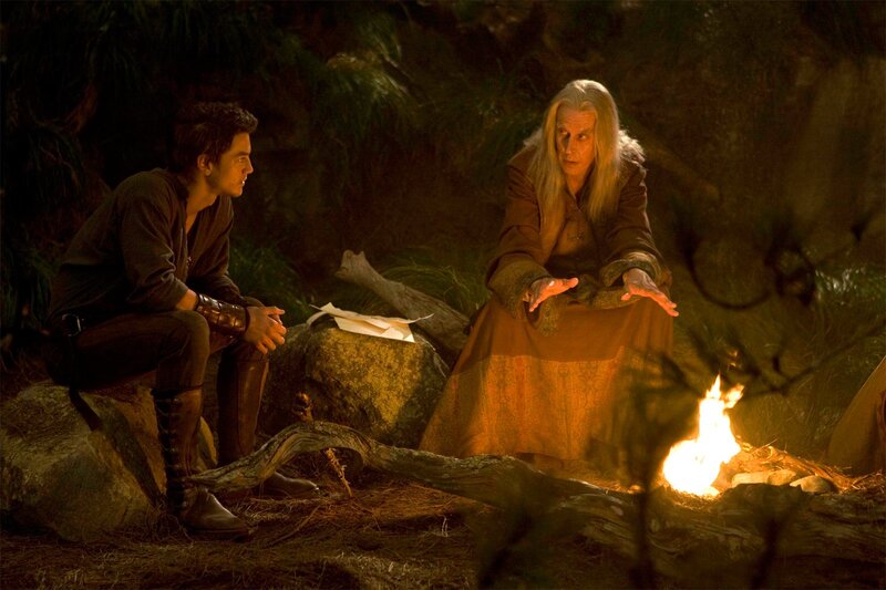 Two men by a campfire