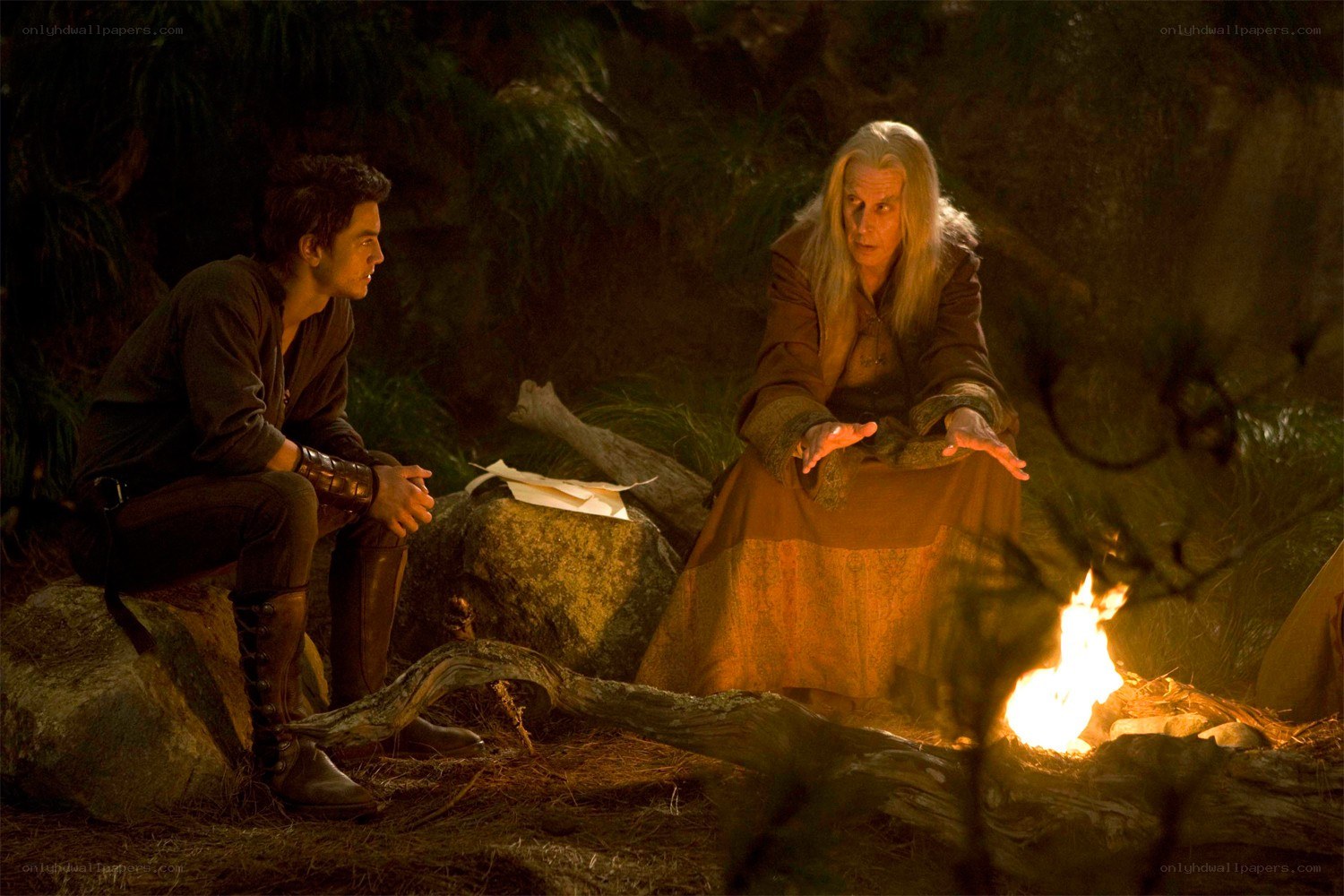 Two men by a campfire