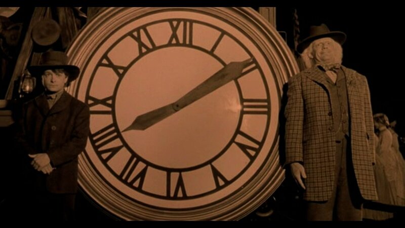 Two Men by Clock