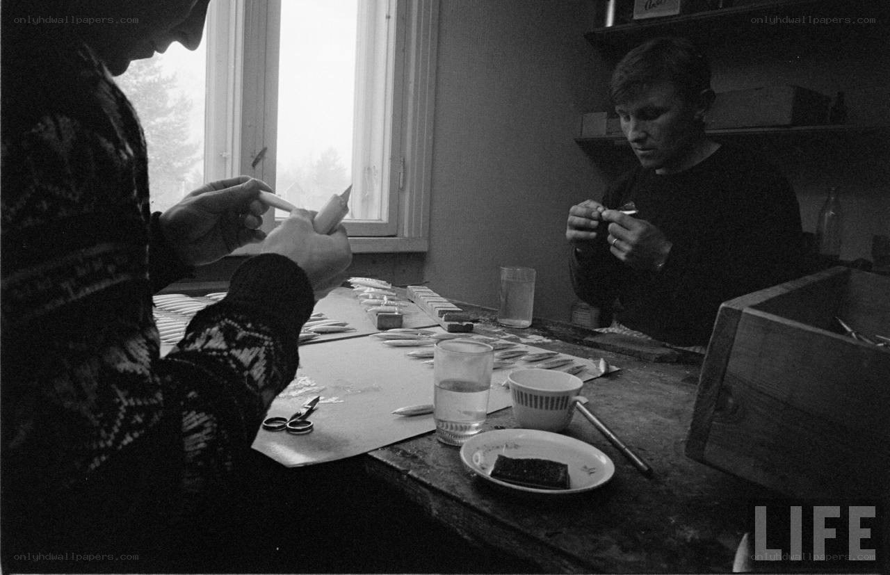 Two men crafting at a table