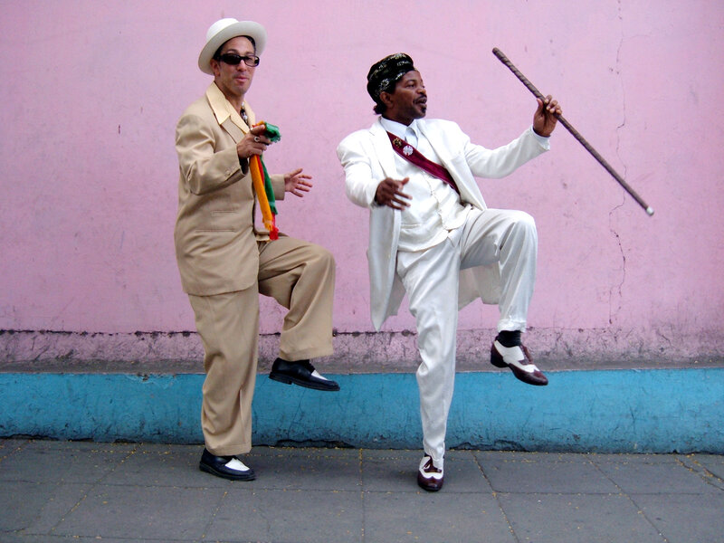 Two men dancing in suits
