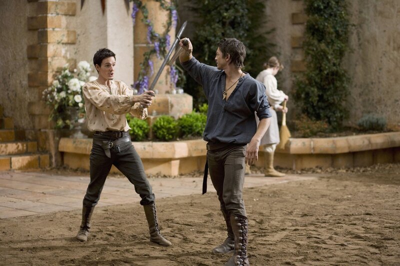 Two men dueling with swords
