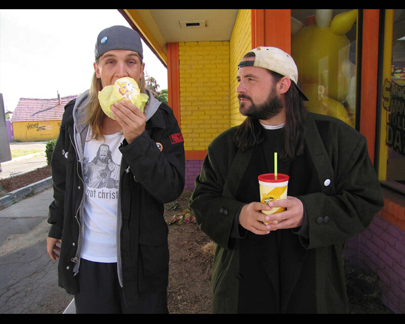 Two Men Eating Fast Food — Yellow