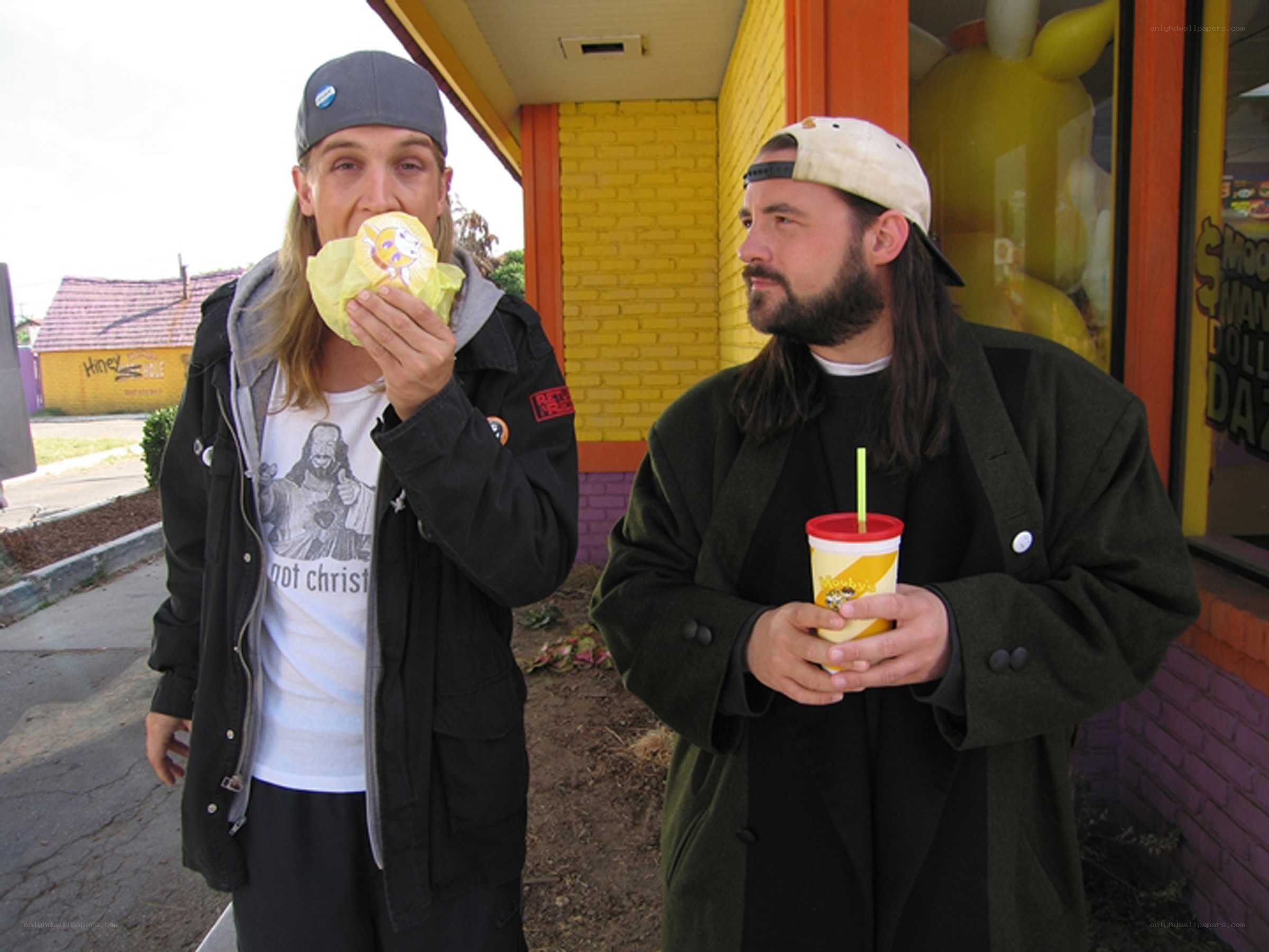 Two men eating fast food