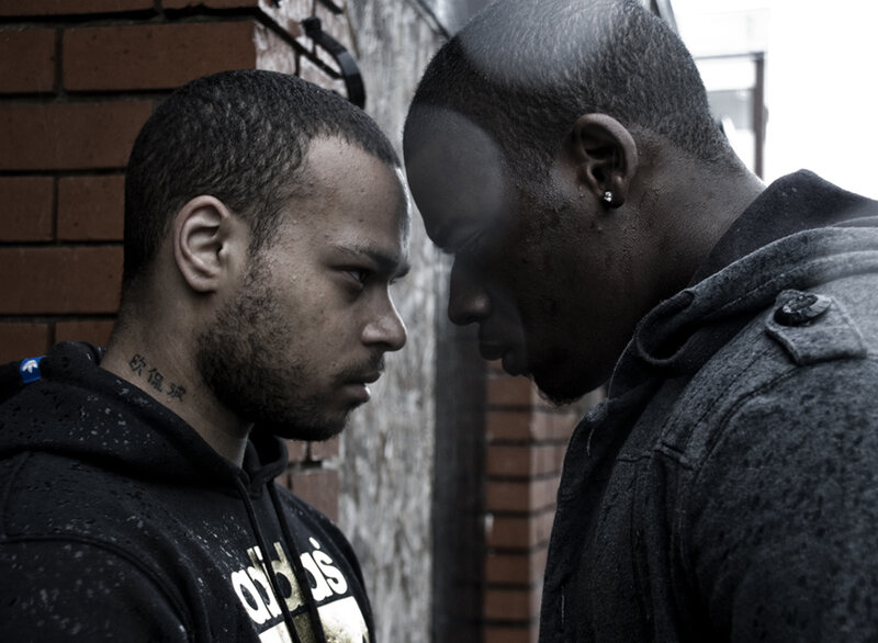 Two Men Facing Each Other — Black, Tense