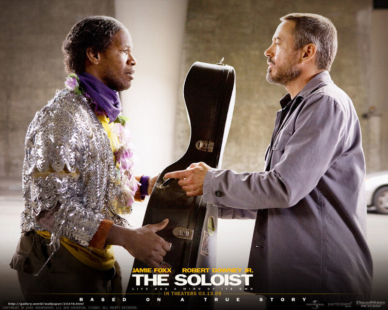 Two Men Holding a Guitar Case