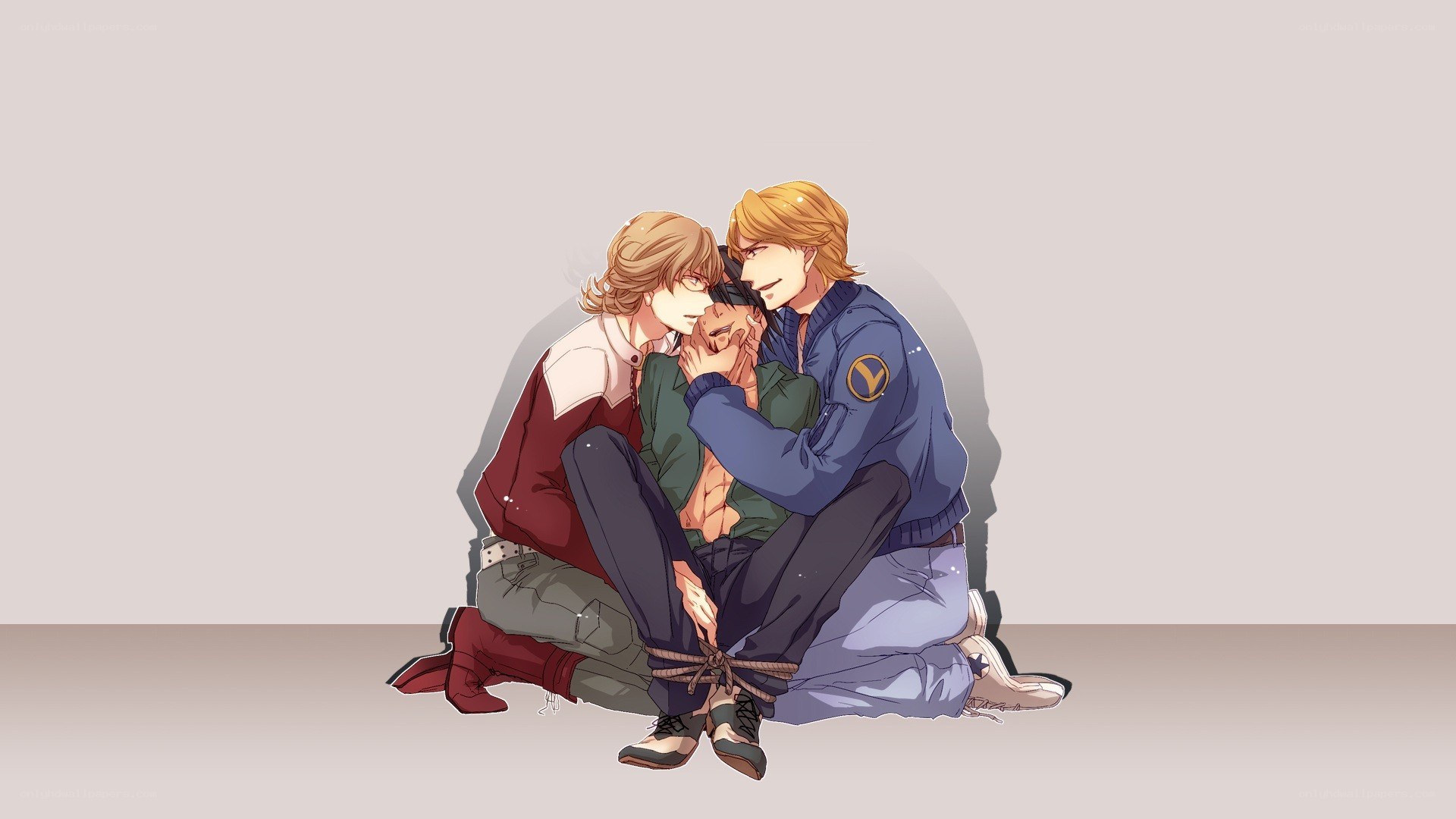 Two men holding a third