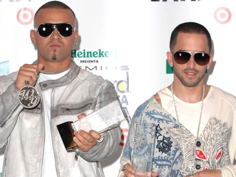 Two men holding awards