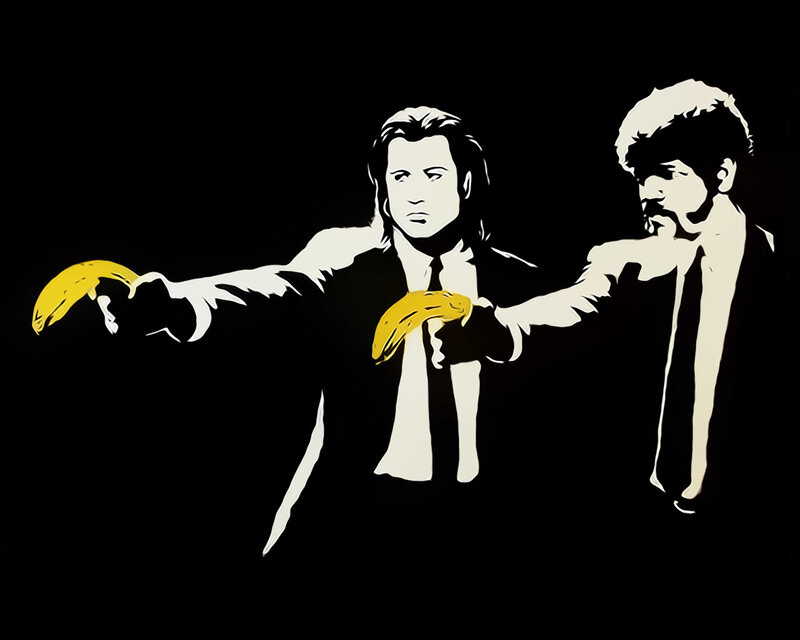 two men holding bananas