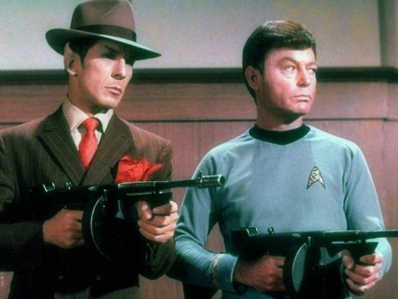 Two Men Holding Guns — Gray
