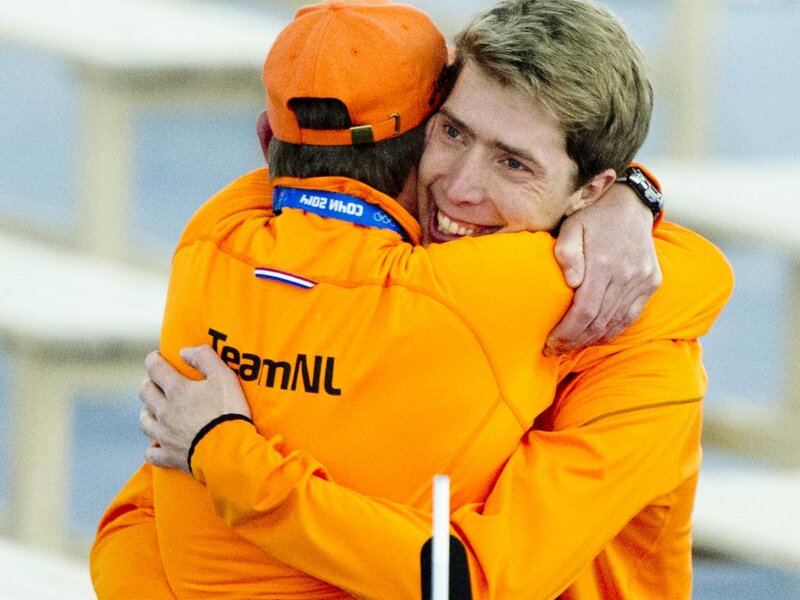 Two Men Hugging — Orange, Joyful