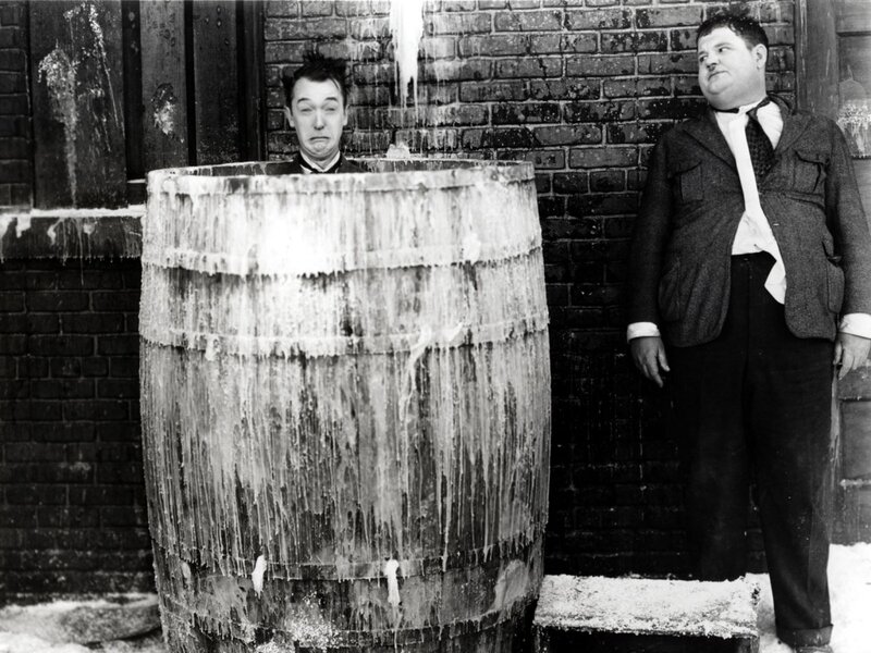 Two men in a barrel of ice water
