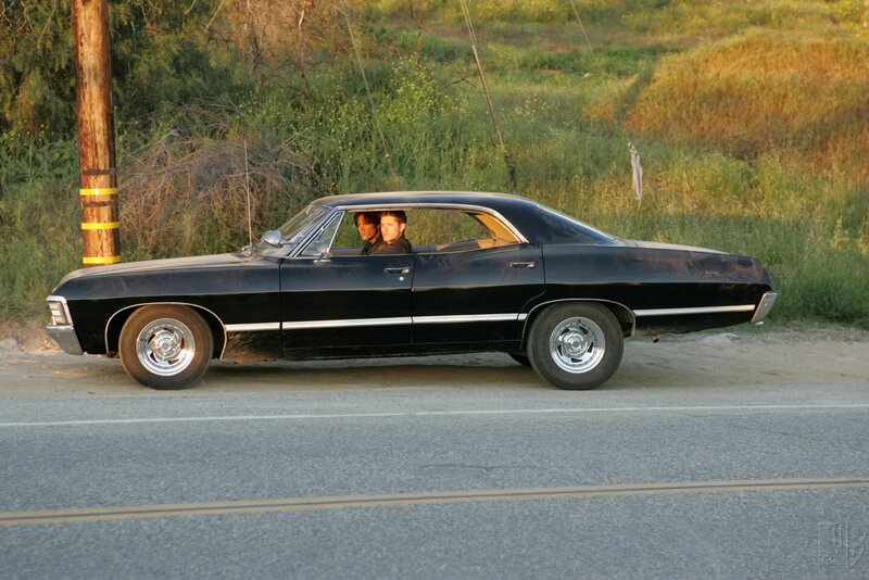 Two men in a black car