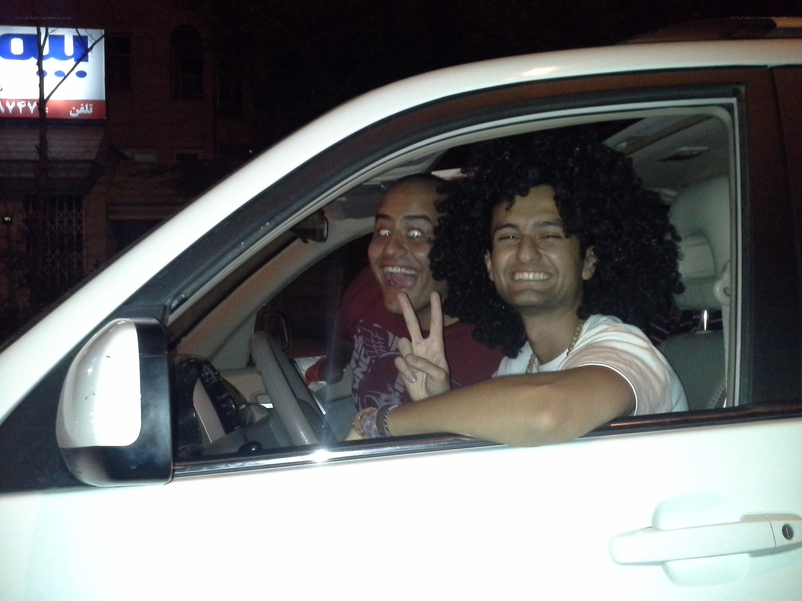 Two men in a car at night