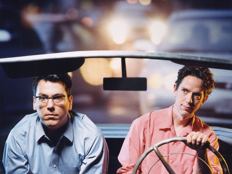 Two men in a car at night