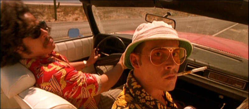 Two men in a car on a road trip
