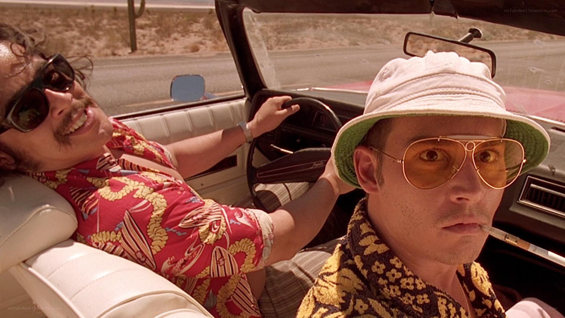 two men in a convertible car