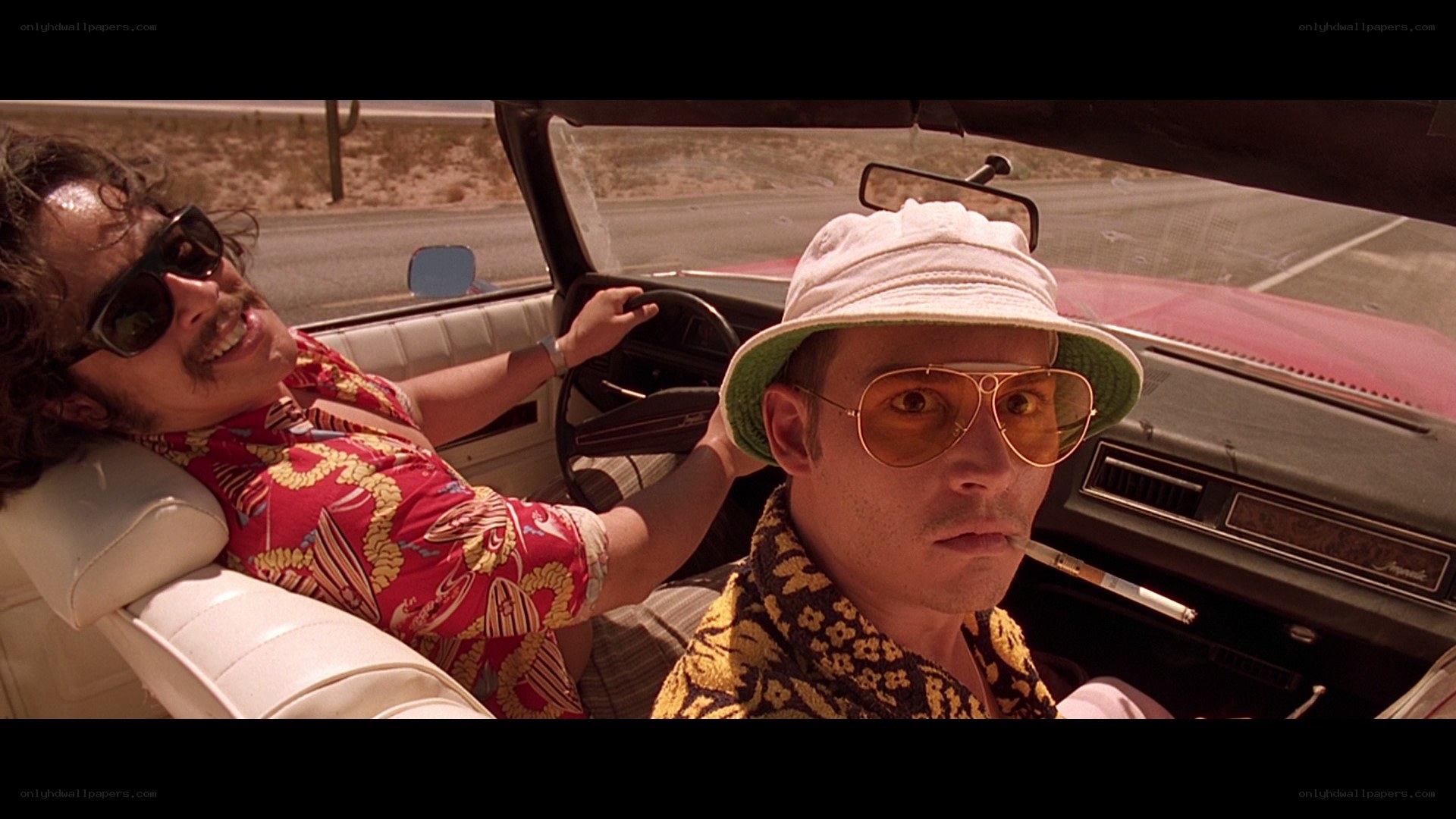 two men in a convertible