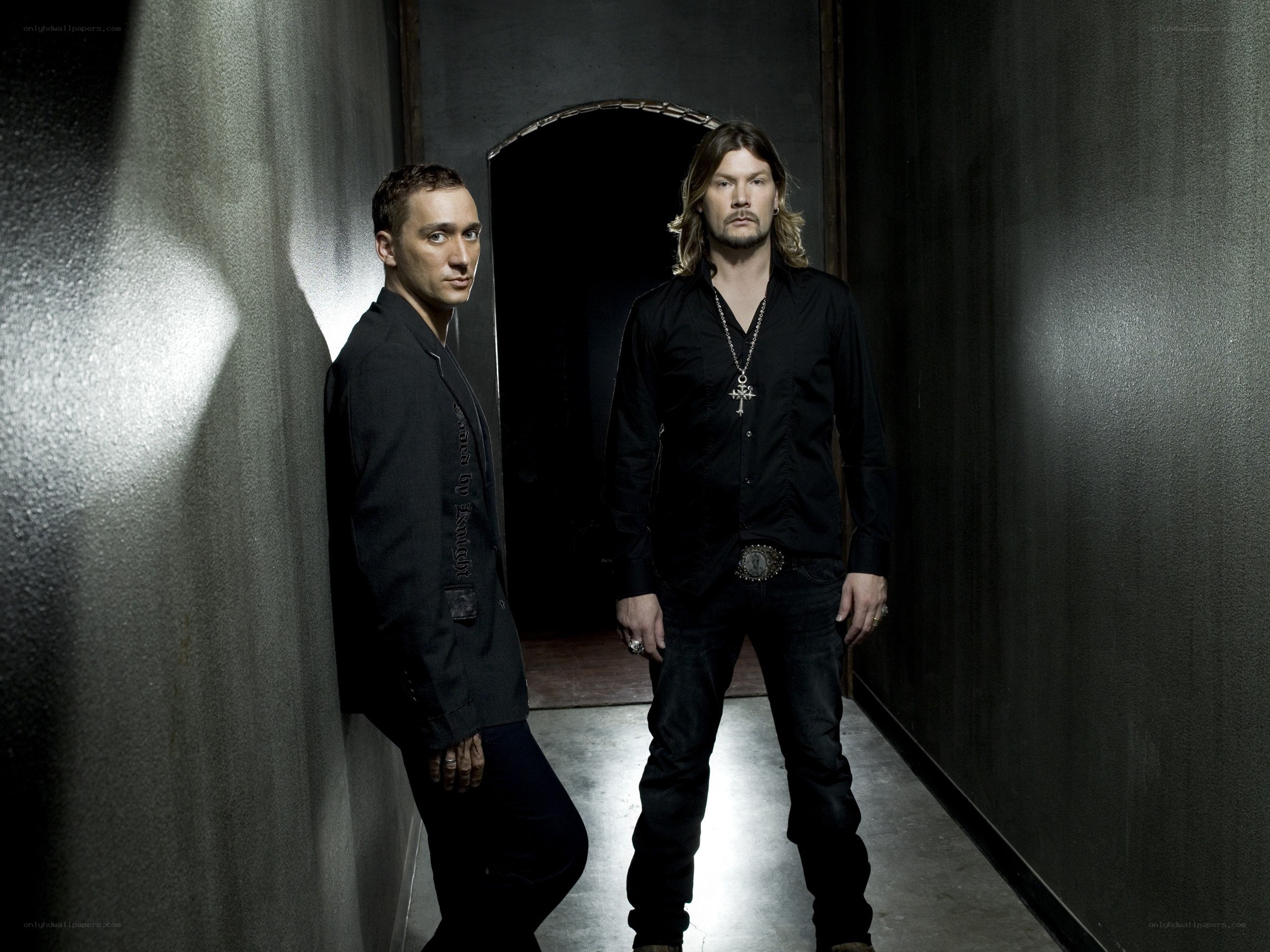 two men in a dark hallway