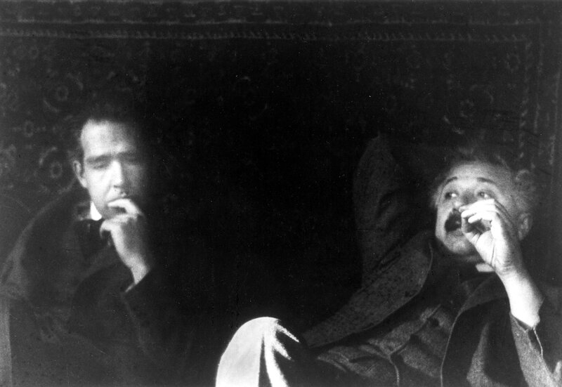 Two men in a dark room