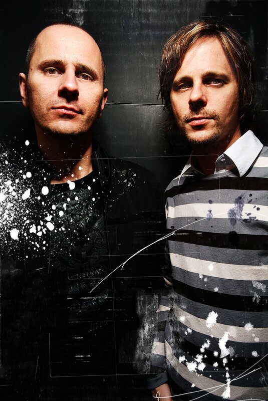 two men in a dark setting