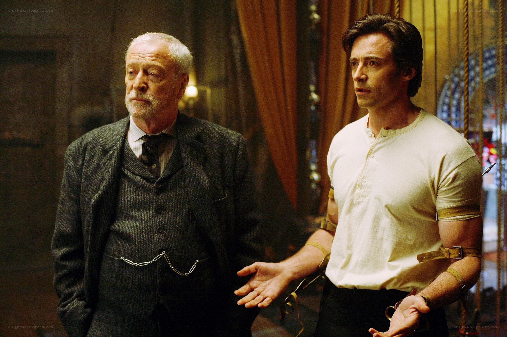 Two men in a dimly lit room