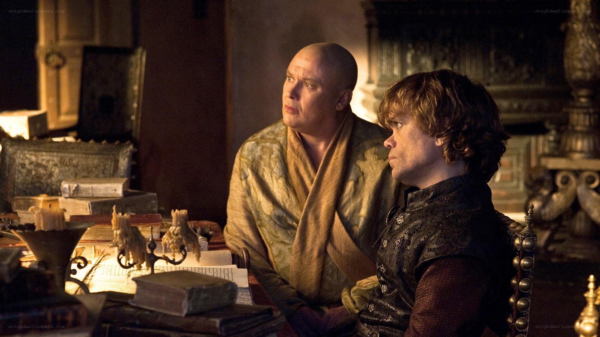 Two men in a dimly lit room