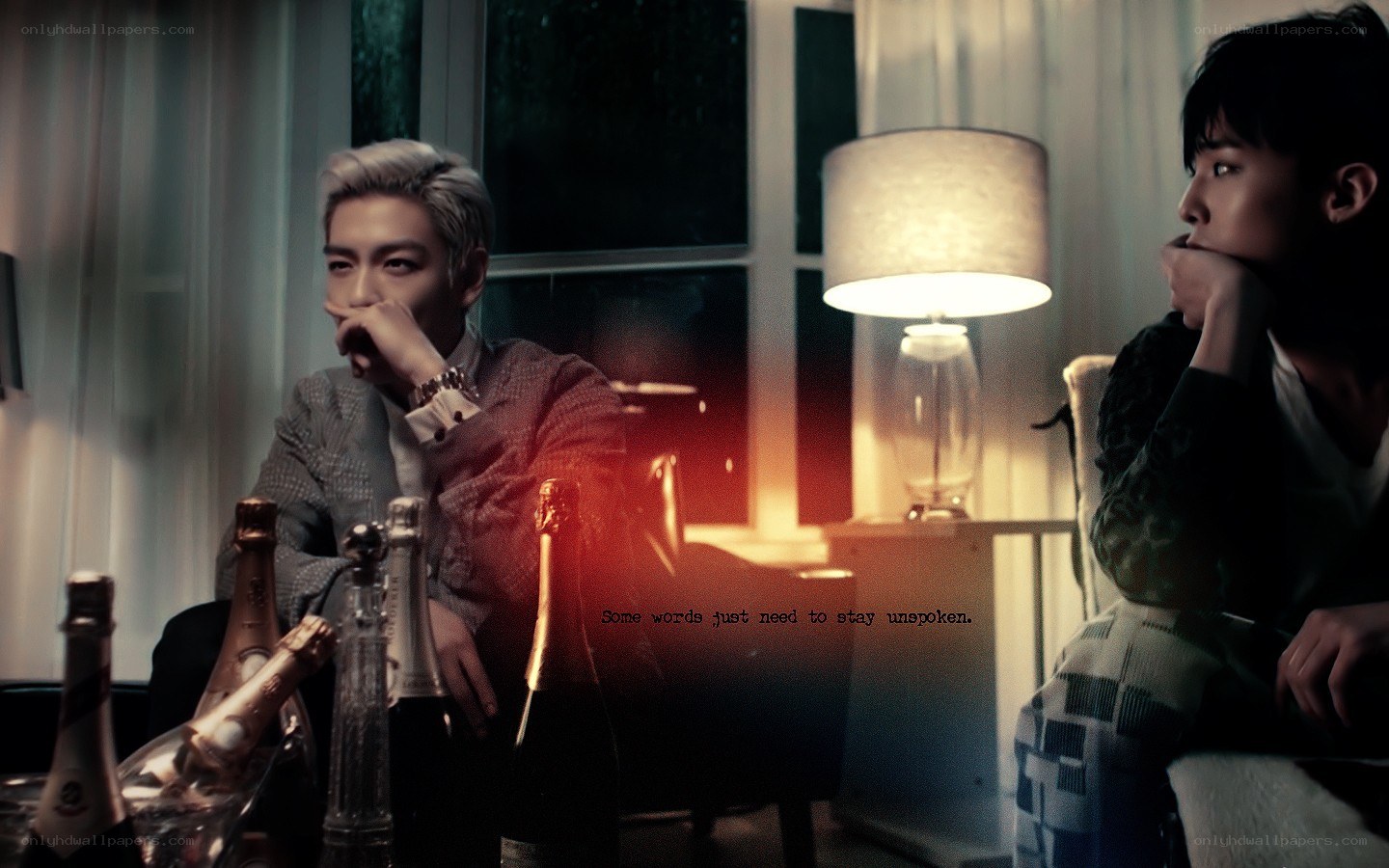 two men in a dimly lit room